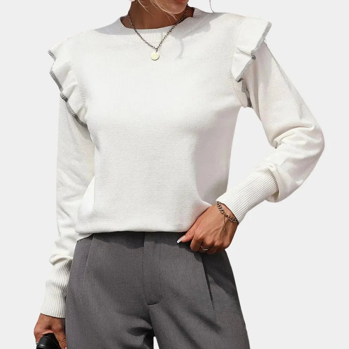 White sweater with ruffle-trimmed crewneck design, made of soft knit fabric.