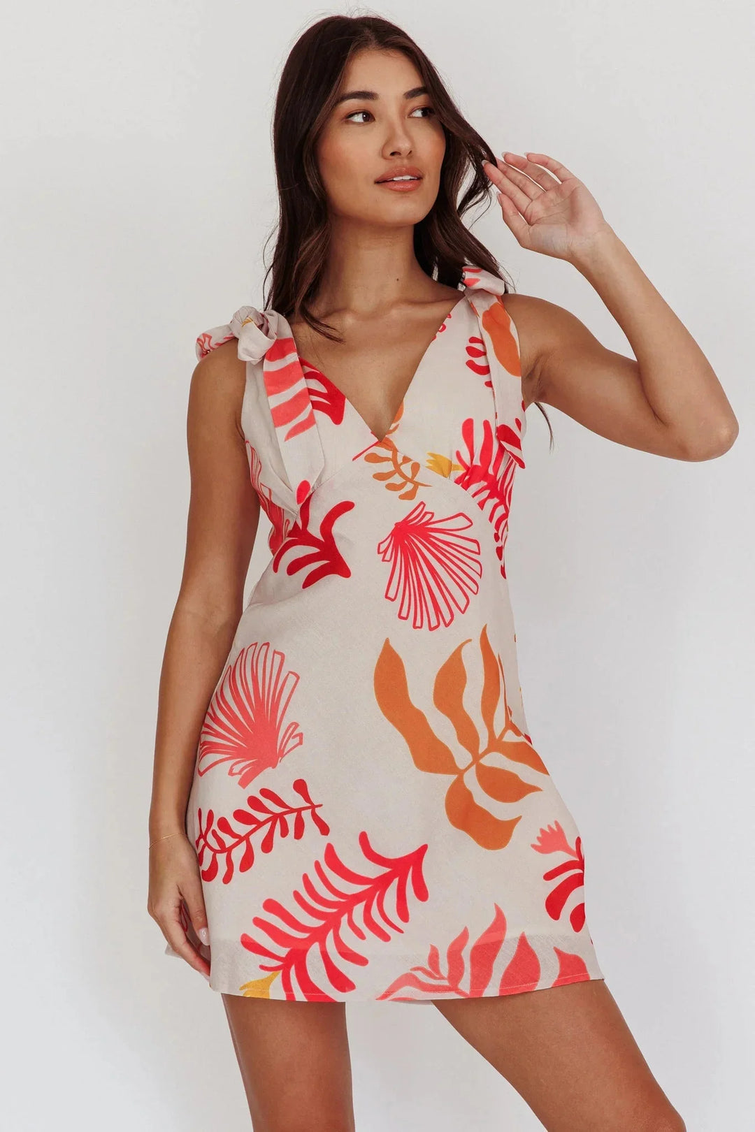 Red floral print V-neck mini dress by Amia. Features a lightweight and breathable fabric perfect for summer days.