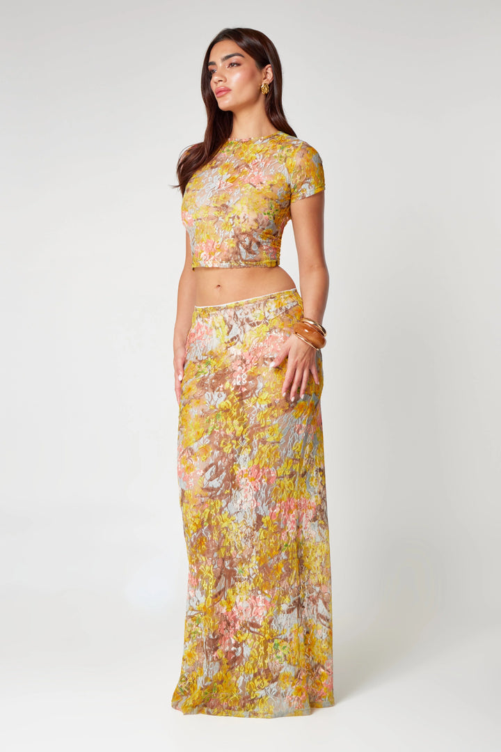"Yellow floral midi co-ord set with a charming print design, perfect for a chic and stylish ensemble."