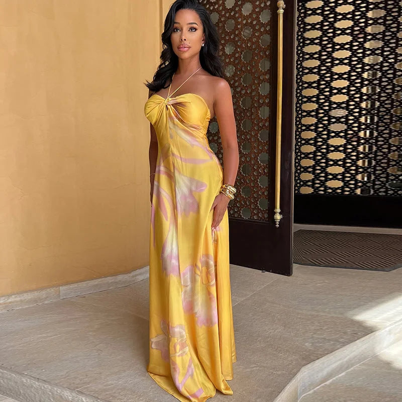 "Strapless yellow floral maxi dress with vibrant flower print, perfect for breezy summer days, made with lightweight and…