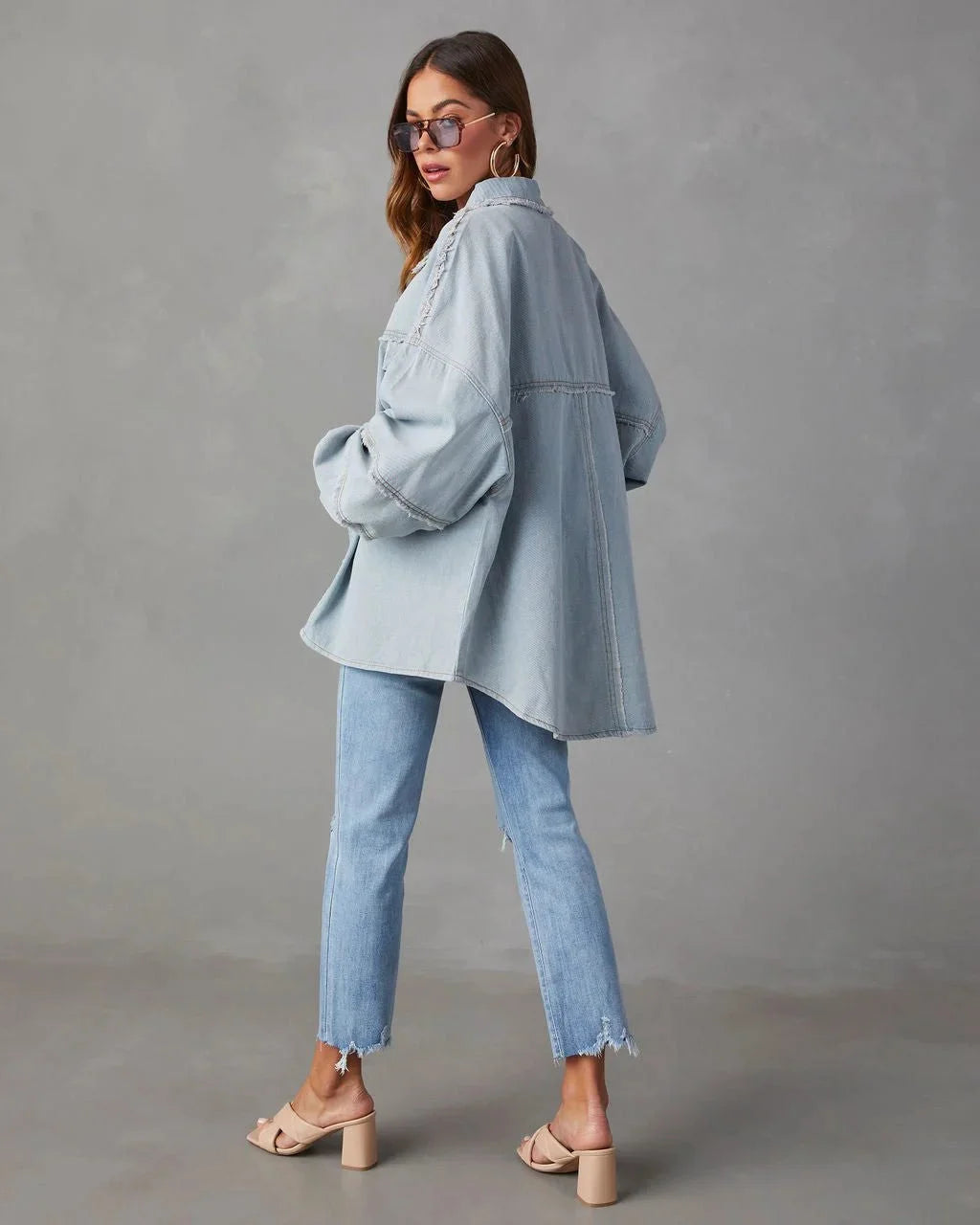 White cotton blouse with chest pockets, ideal for casual wear.