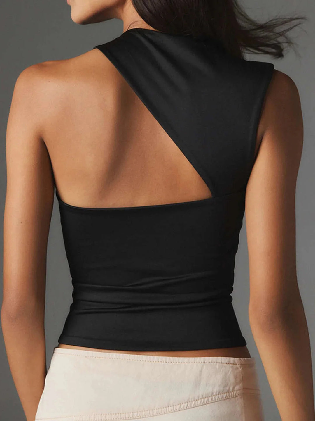Sleeveless scoop neck top in soft ribbed fabric with fitted silhouette, perfect for everyday wear or layering.
