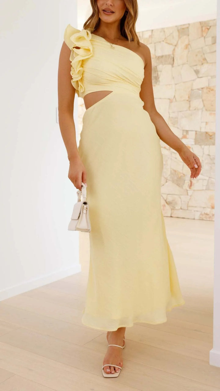 Yellow one-shoulder maxi dress with cutouts in a figure-flattering design, perfect for a modern chic look.