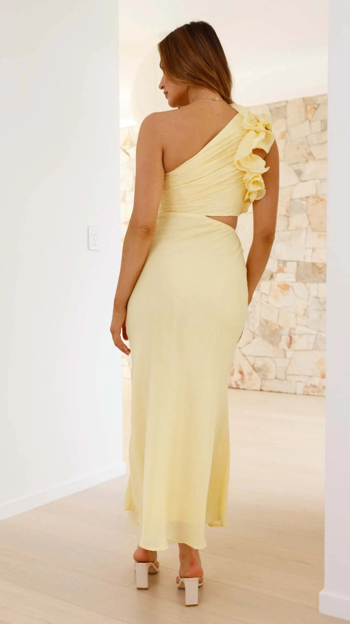 Yellow one-shoulder maxi dress with cutouts, features a sleek silhouette, perfect for any special occasion.