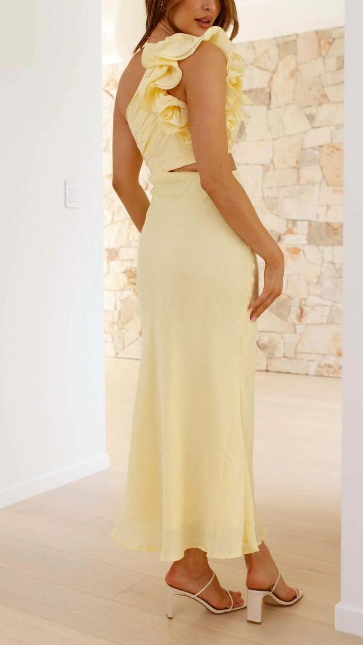 Yellow one-shoulder maxi dress with cutouts, featuring a structured design, made of lightweight fabric ideal for formal…