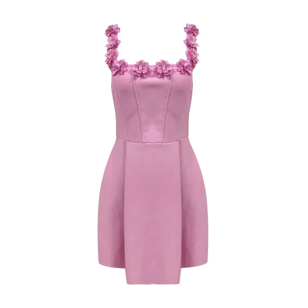 "Sleeveless pink dress with delicate floral details, perfect for a casual day out or special occasion."