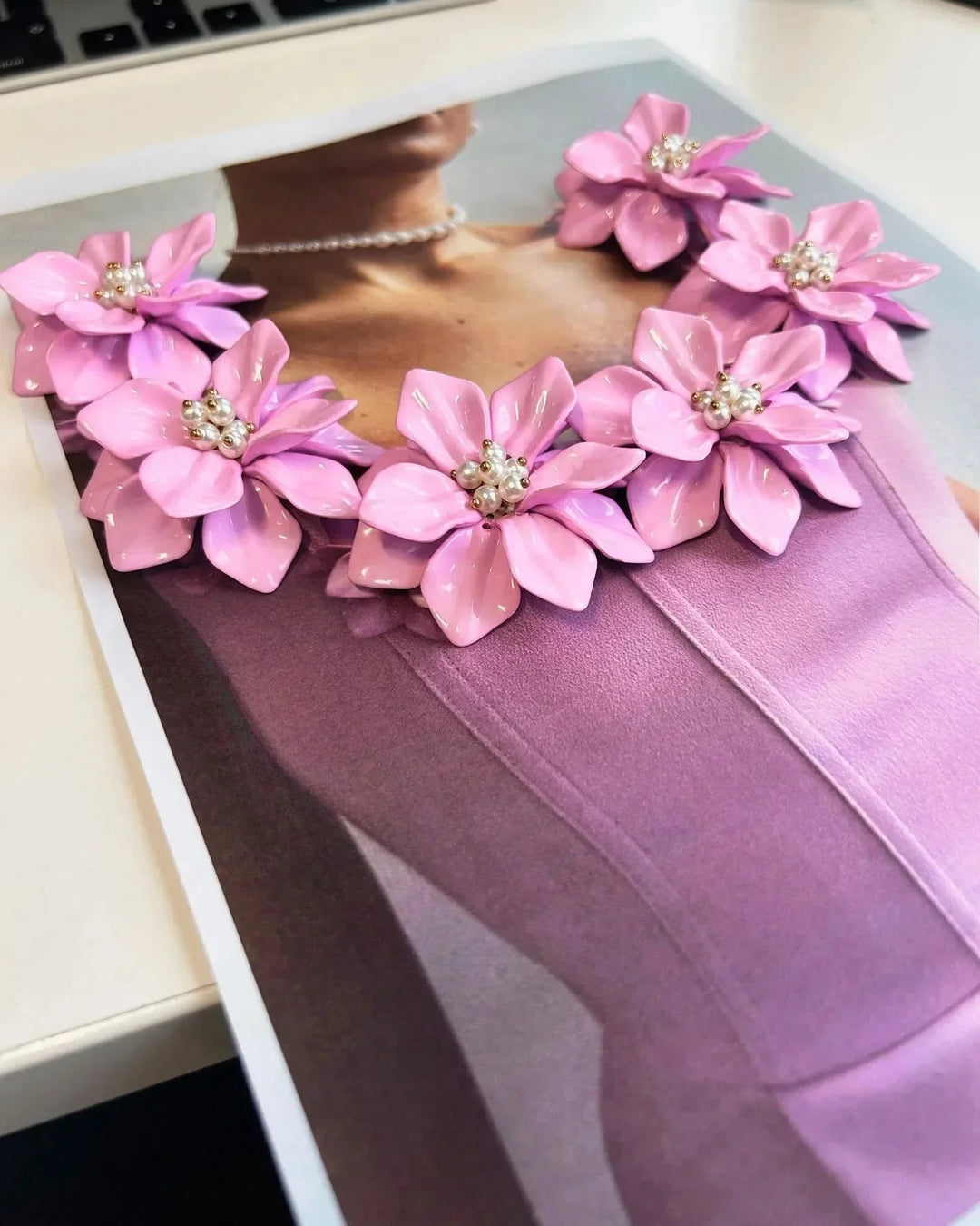 "Sleeveless pink dress featuring delicate floral details, tailored for a feminine and stylish look. Perfect for any summer…