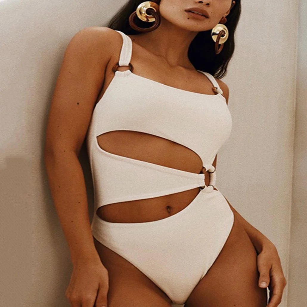 "One-shoulder ivory swimsuit with cutout design. Elegant and chic in Colour."