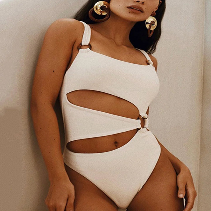 "One-shoulder ivory swimsuit with cutout design. Elegant and chic in Colour."