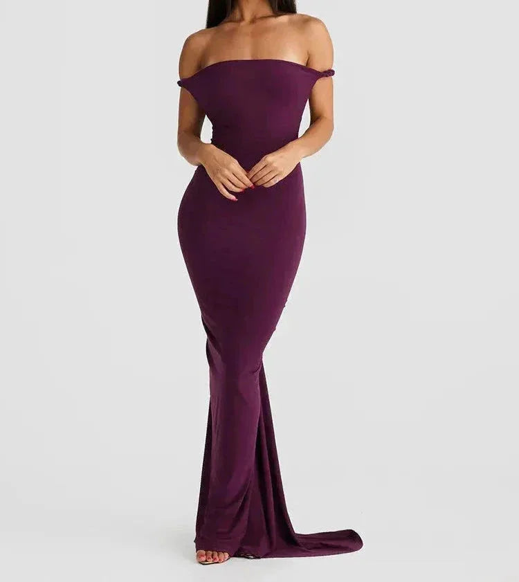 "Black slim-fit maxi dress with spaghetti straps, perfect for summer evenings, made from lightweight breathable fabric."