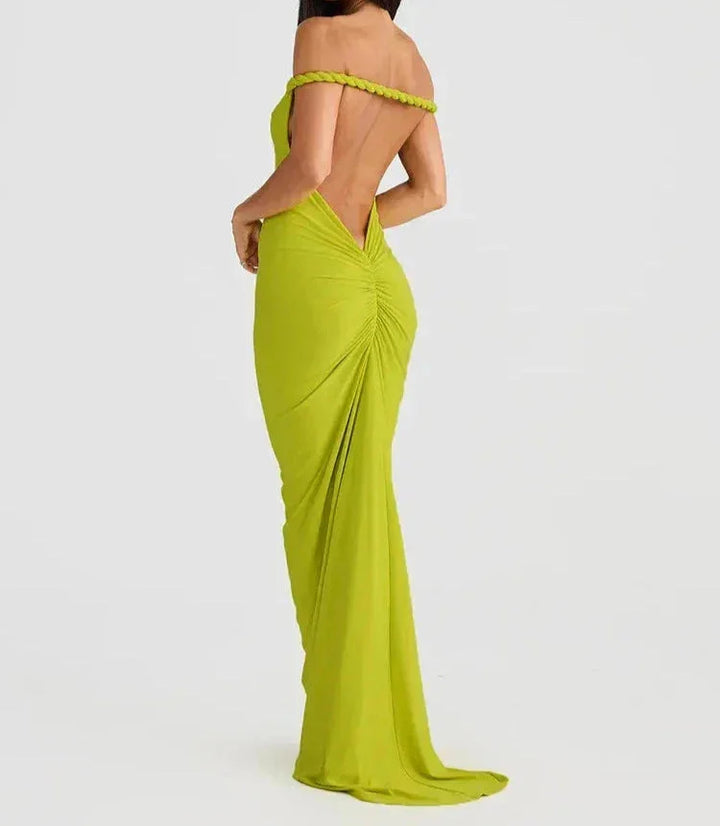 Black slim-fit maxi dress with spaghetti straps, made from soft cotton blend fabric, perfect for a casual yet stylish look.