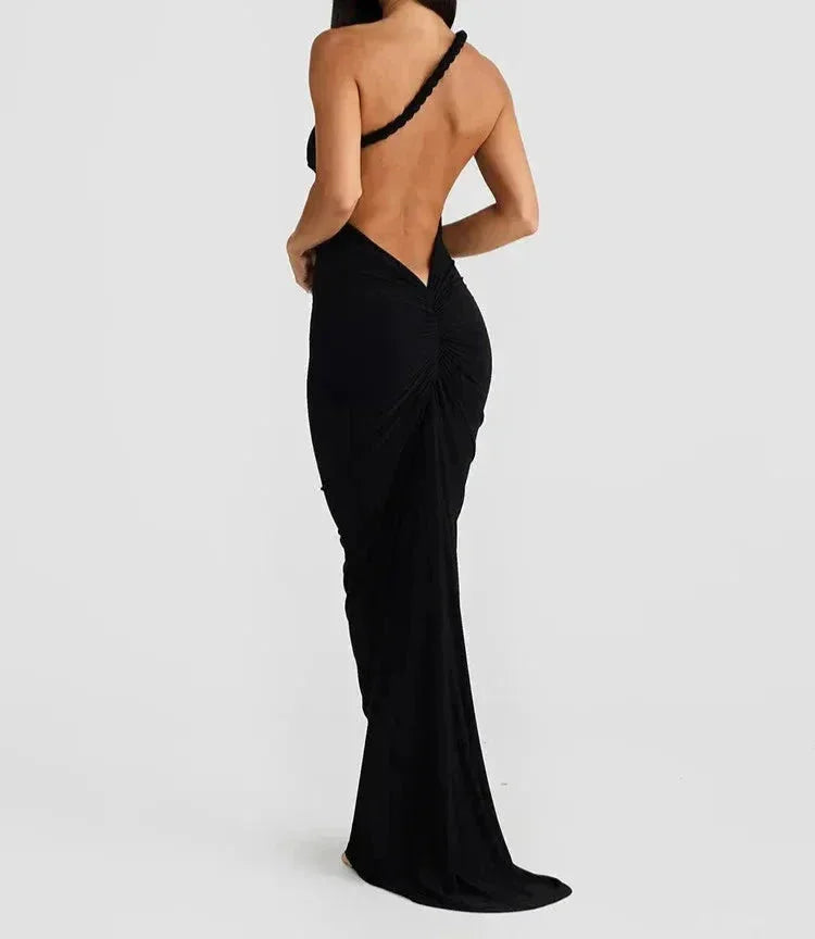 "Black slim-fit maxi dress with spaghetti straps, perfect for casual or formal occasions, made from lightweight, breathable…