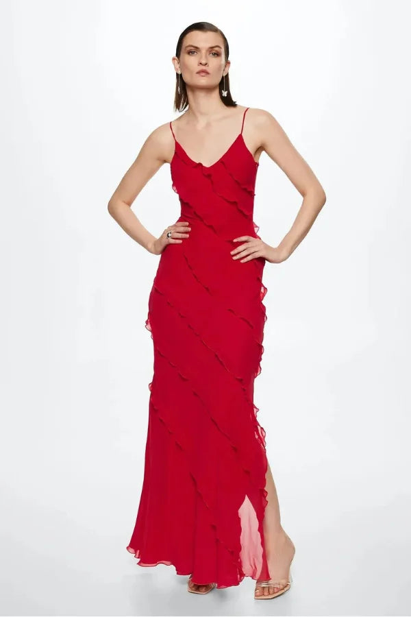 Red spaghetti strap maxi dress with layered design. Features a flowing silhouette in a lightweight and breathable fabric.