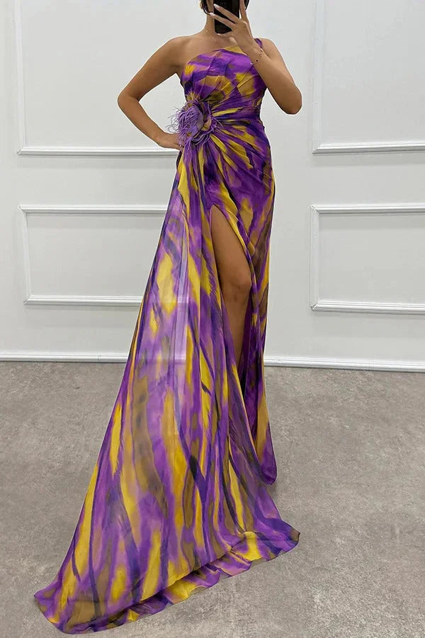Purple strapless maxi dress with floral accent, made from soft and flowy fabric. Ideal for special occasions or summertime…