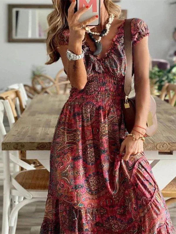 Bohemian V-neck maxi dress with tiers made of soft, flowing fabric in a relaxed fit. Features a unique pattern perfect for…