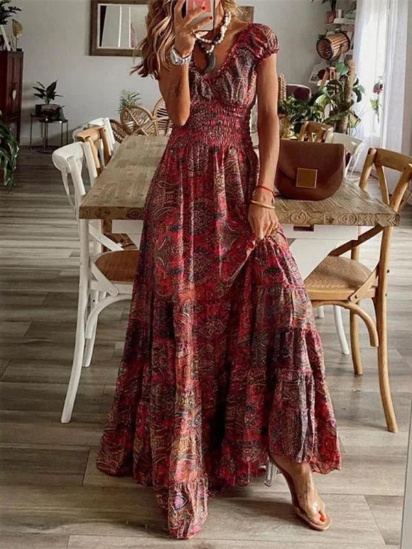 Arleth red maxi dress with V-neck, tiered design, perfect for bohemian style, made from lightweight and breathable fabric.