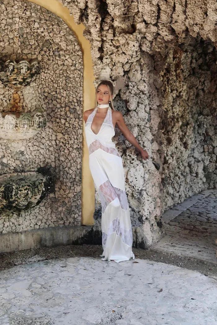 Sleeveless halter maxi dress with lace details, perfect for summer, made of lightweight fabric ideal for warm weather…