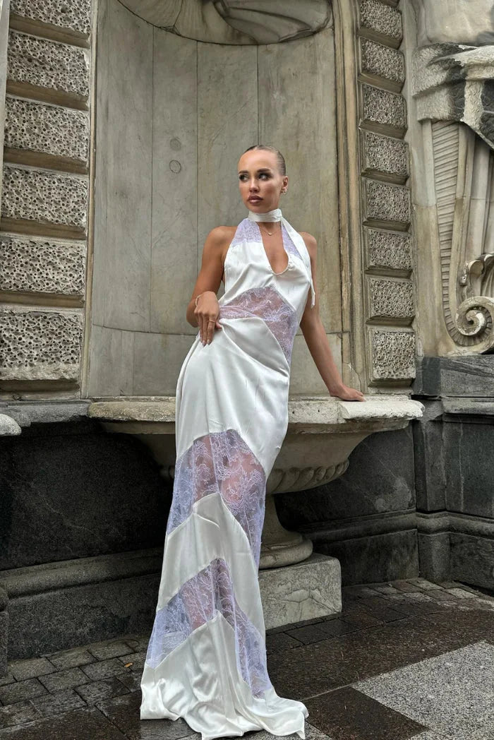 "White sleeveless halter maxi dress with lace details for a sophisticated look"
