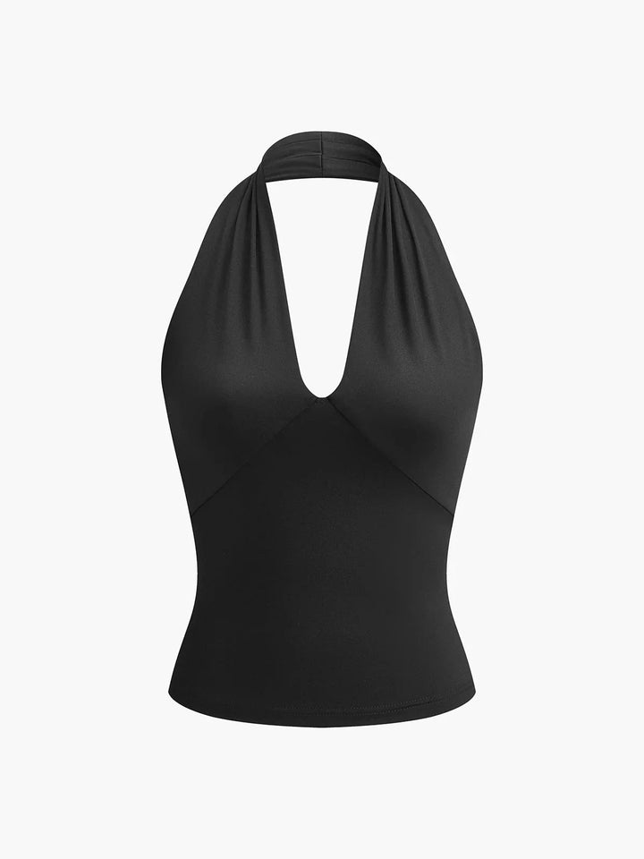 Black halter crossover top made from soft satin fabric, featuring a sleek and modern design.