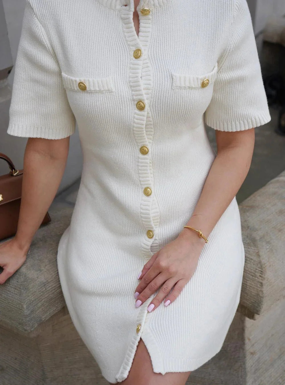 Short sleeve ribbed mini dress in Ashlee design, made of soft, stretchy fabric, perfect for a casual-chic look.