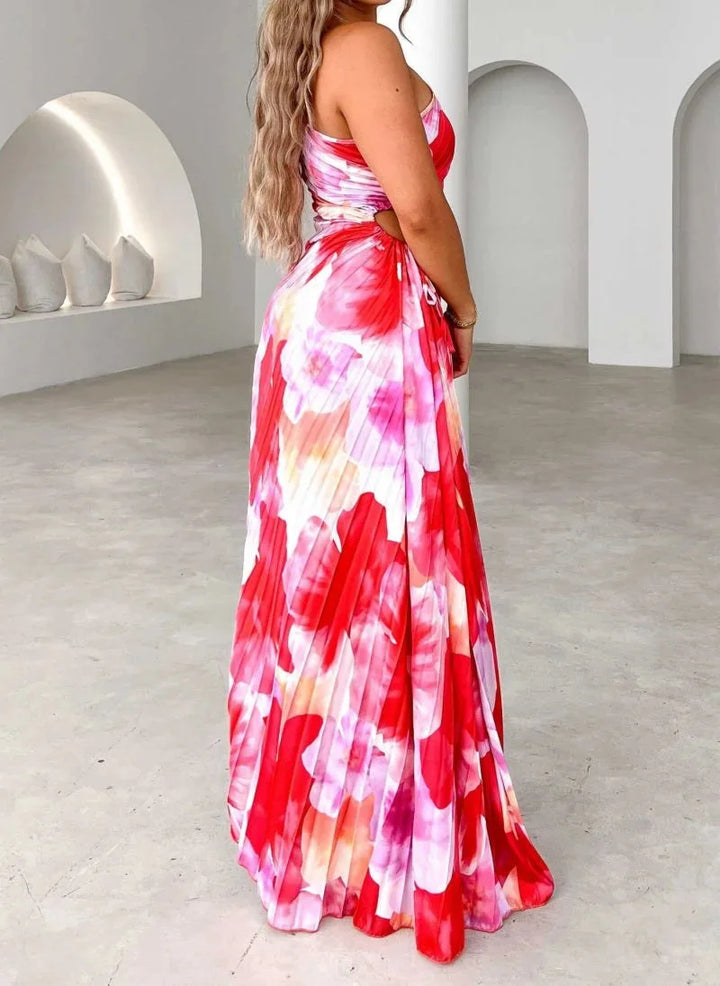 "Flowing floral maxi dress with an asymmetrical neckline in soft, breathable fabric."