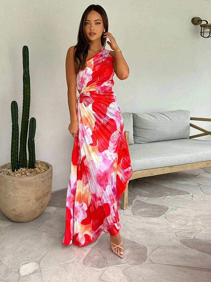 "Floral print maxi dress with an asymmetric neckline, ideal for casual or formal events, made with lightweight and…