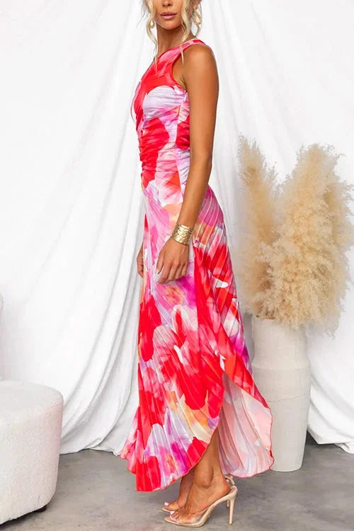 Floral maxi dress with an asymmetric neckline in a flowy fabric, perfect for a casual yet stylish look.