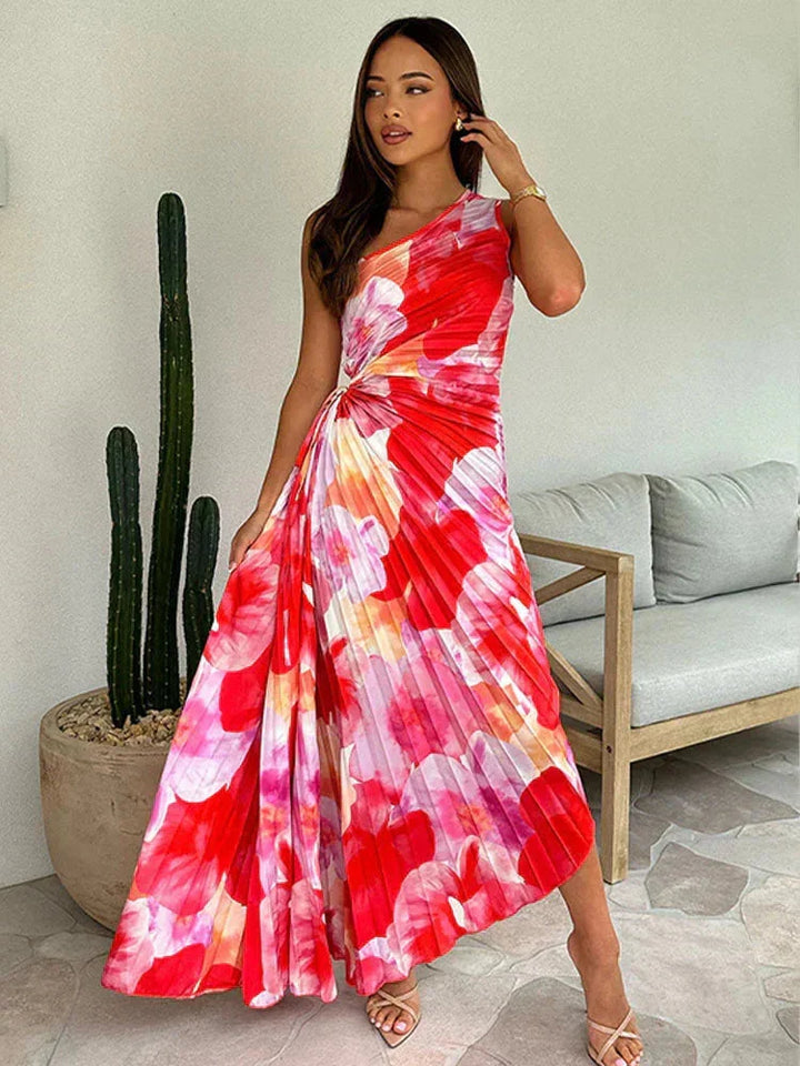 "Floral maxi dress in soft fabric with an asymmetric neckline featuring a botanical print and a flowing silhouette."
