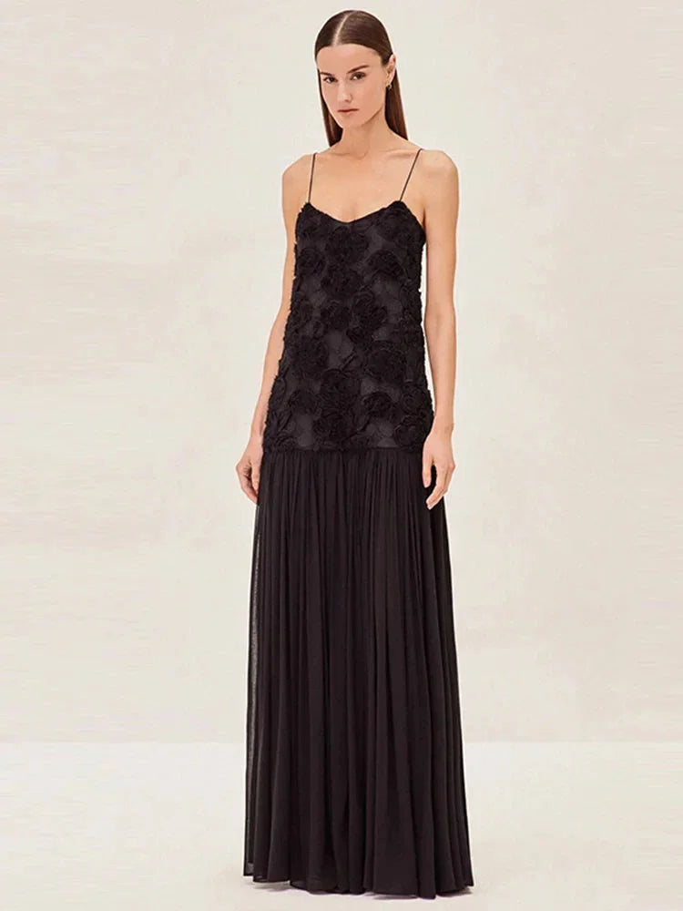 "Blue lace maxi dress with sleeveless design and illusion neckline, perfect for a feminine and elegant look."