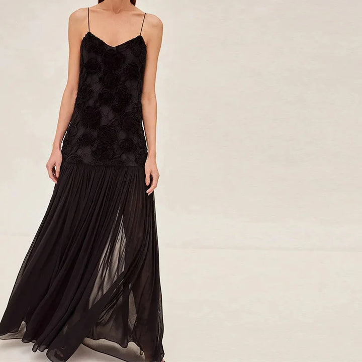 "Black lace sleeveless maxi dress featuring elegant lace detailing and a flowing design."