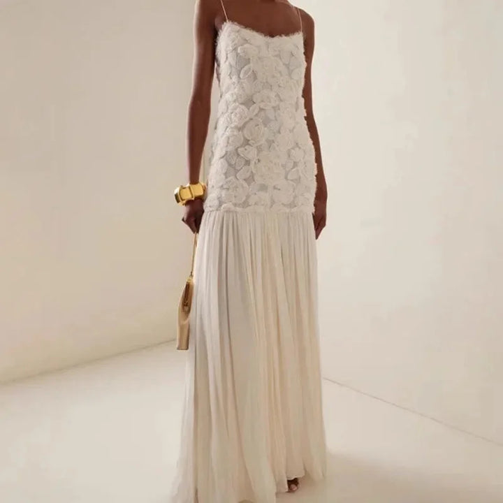 Off White lace maxi dress with intricate sleeveless design, perfect for a stylish and elegant look.