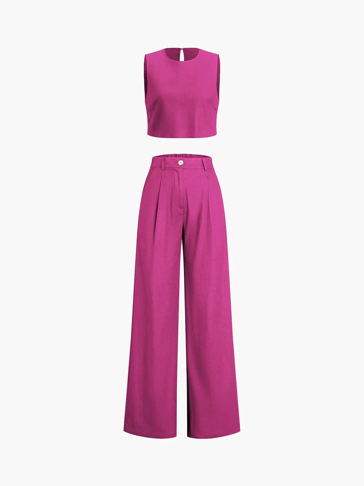 "Black women's crop top and wide-leg pants set with asymmetrical design, made from soft, breathable fabric for a trendy and…