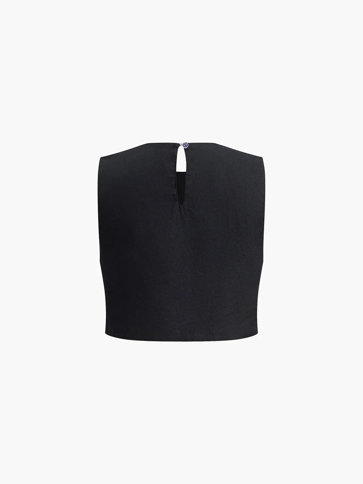 Atarah - Two-piece set with asymmetrical crop top and wide-leg pants in soft, lightweight fabric.