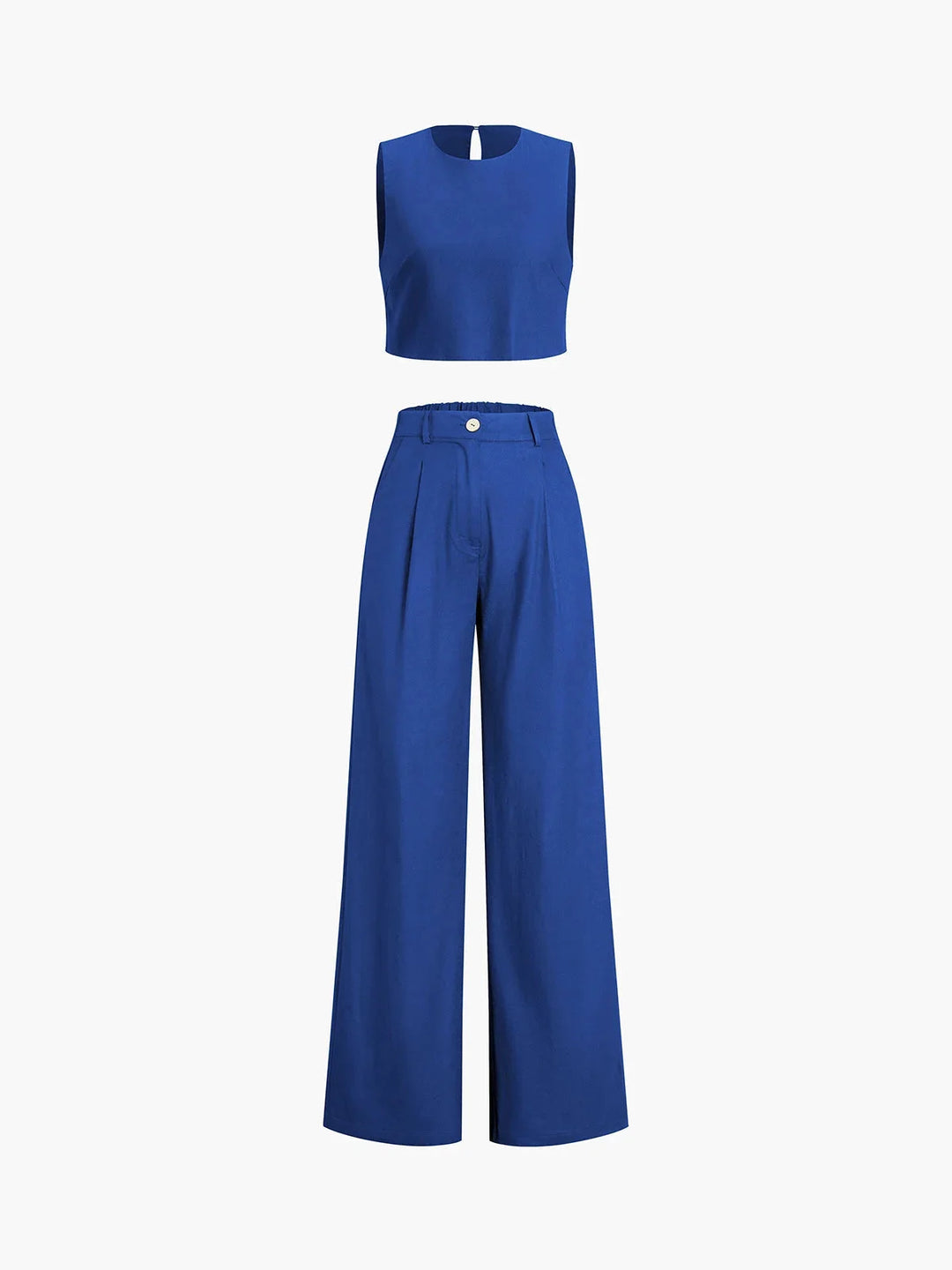 Black crop top with asymmetrical cut, paired with wide-leg pants in matching fabric and color. Feminine and chic ensemble…