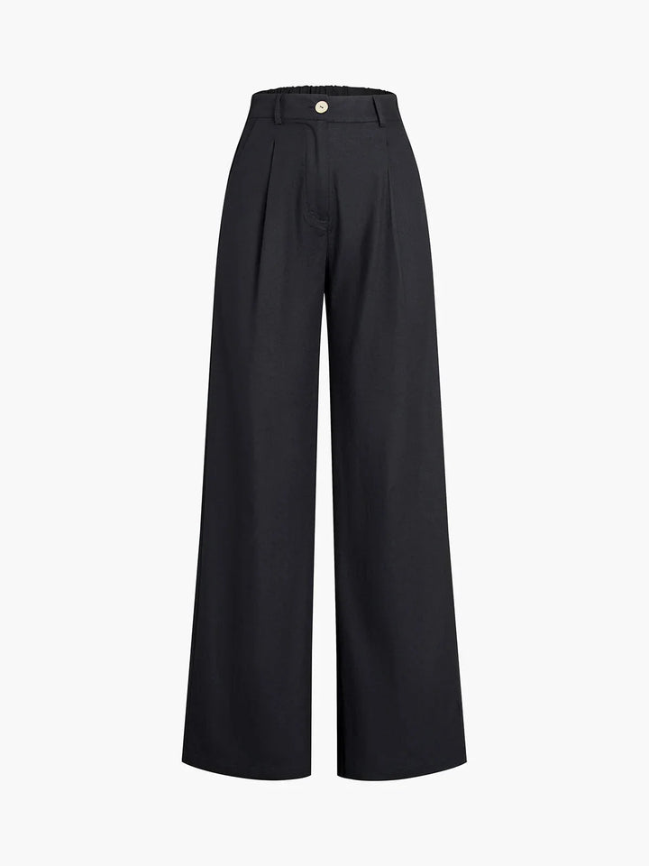 "Black crop top with asymmetrical neckline paired with matching wide-leg pants in soft cotton blend fabric."