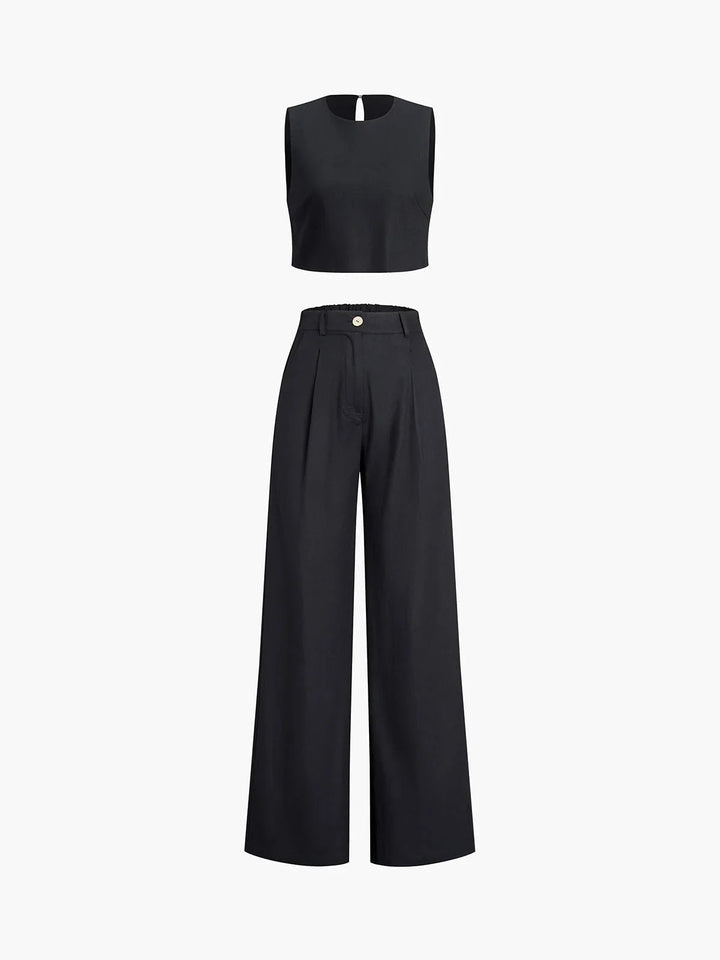 "Black linen crop top with white stripes & matching wide-leg linen pants in a trendy asymmetrical design."