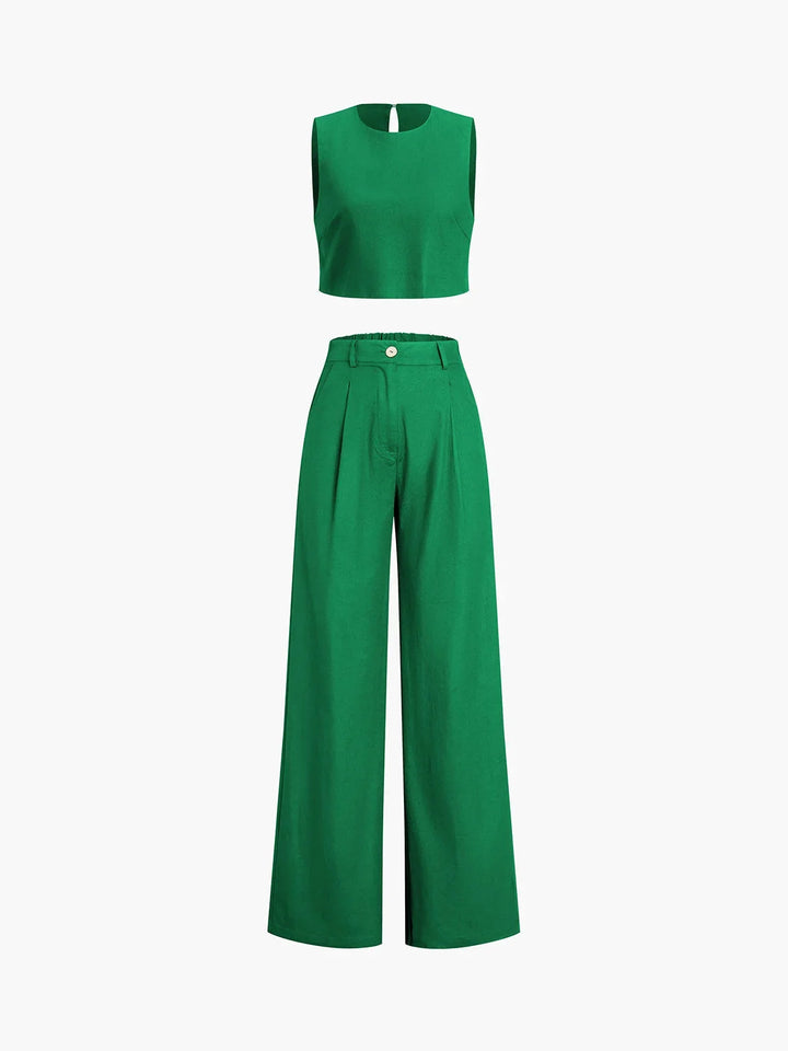 "Asymmetrical crop top and wide-leg pants set in soft linen blend fabric with a chic, modern silhouette."