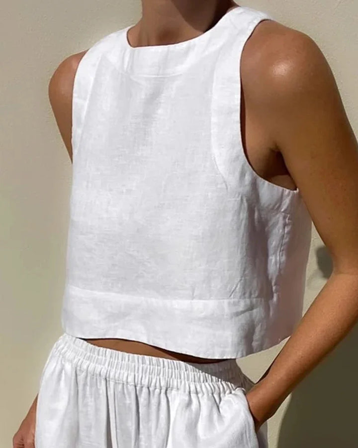 Sleeveless top and flowing pants set in soft cotton blend with a checkered pattern, perfect for casual wear or lounging at…