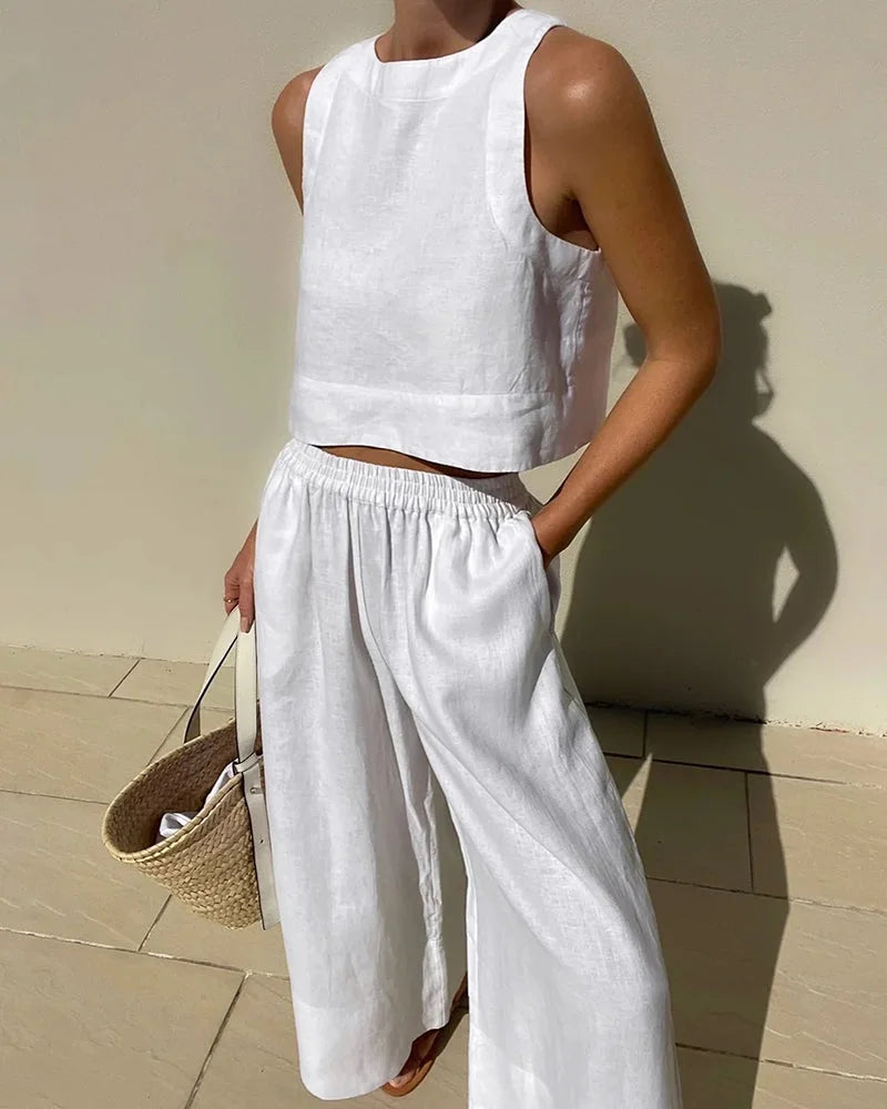 "Sleeveless top and flowing pants set, made from lightweight cotton blend with delicate floral pattern."
