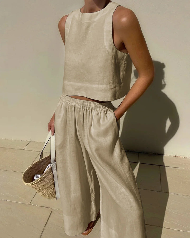 "Slate gray sleeveless top with high neckline and matching flowing pants set, ideal for casual, everyday wear."