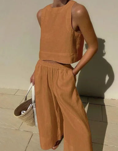 Brown sleeveless top and flowing pants set, made from soft cotton blend. Stylish ensemble for casual elegance and comfort.