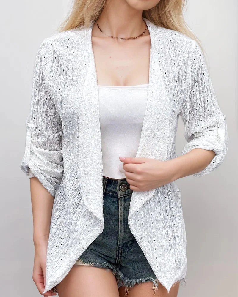White cropped cardigan in textured fabric with an open-front design by Aurelia.