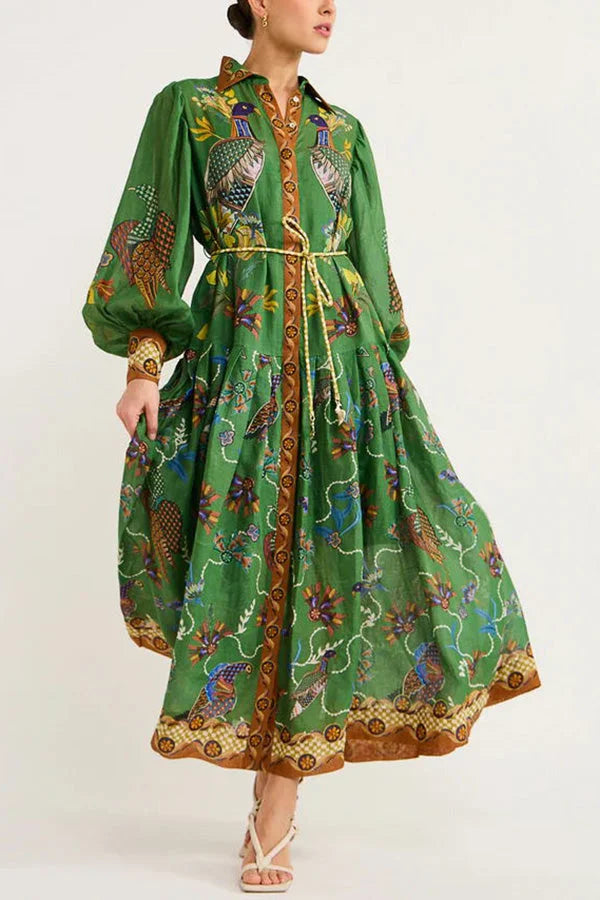 Green midi dress with whimsical bird print and elegant sleeves, perfect for a nature-inspired look.