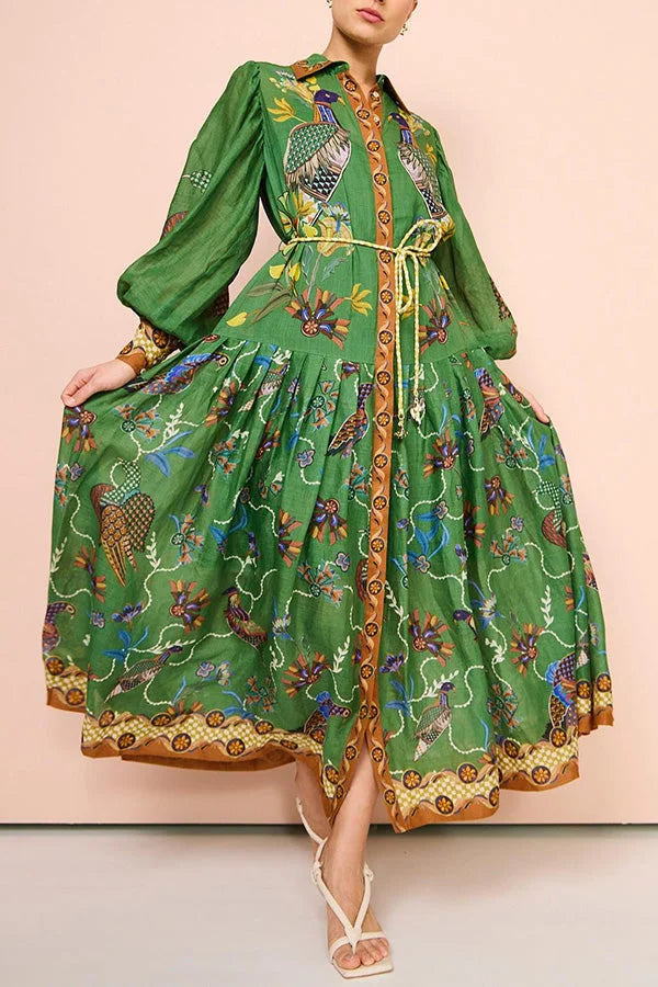 Green midi dress with bird print, featuring stylish sleeves. High-quality, flowy fabric perfect for sunny days or casual…