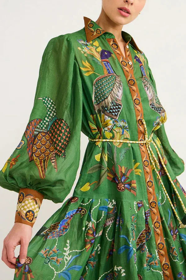 "Ava green midi dress featuring charming bird print with flutter sleeves, perfect for adding whimsical flair to your…