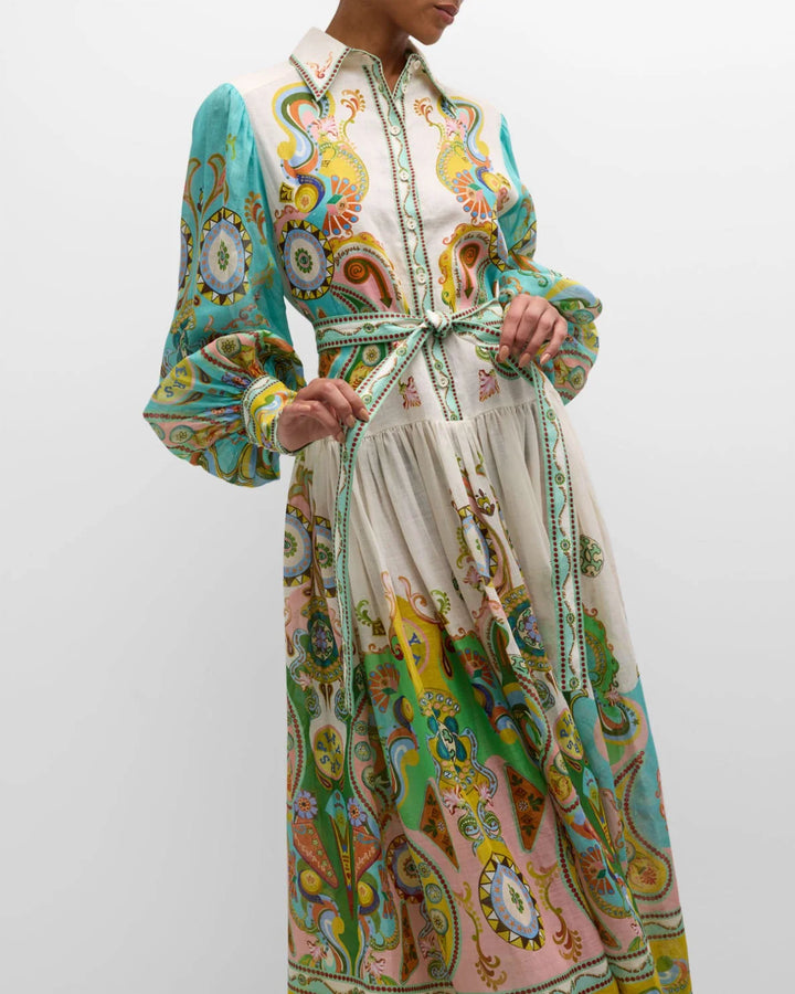 Avacyn maxi dress in paisley print with balloon sleeves, made with flowing fabric and bohemian style.
