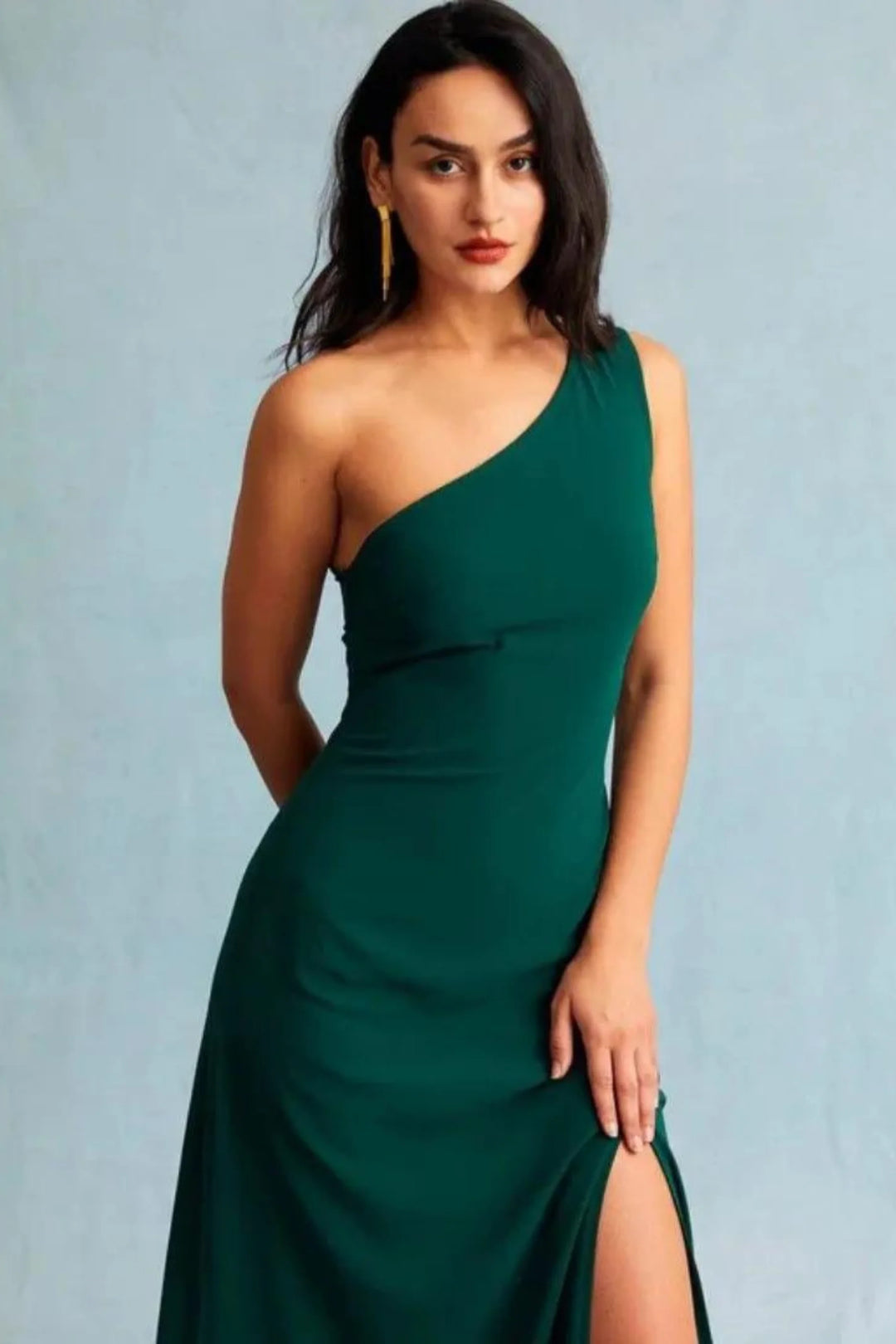 Dark green one-shoulder maxi dress made from soft chiffon, perfect for formal events and special occasions.