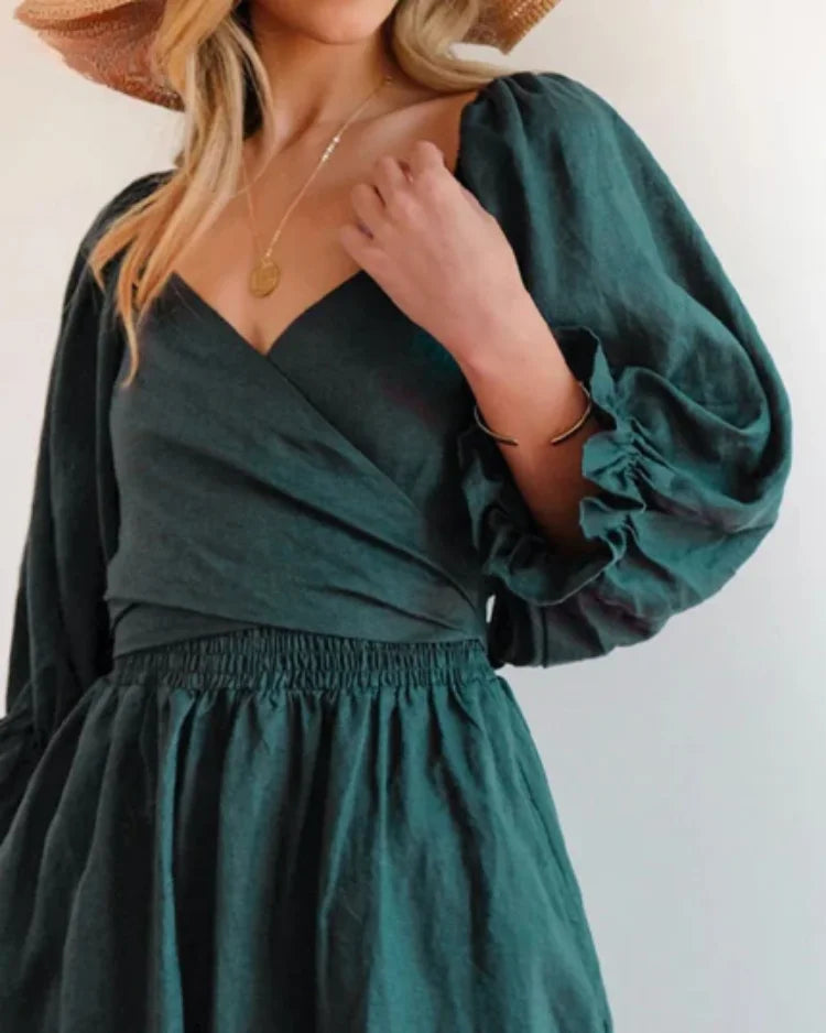 Avelina wrap dress in black jersey fabric with deep V-neck, perfect for a casual chic look.
