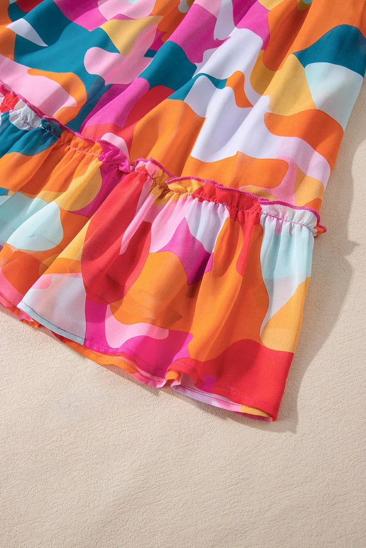 Vibrant printed V-neck babydoll dress in soft cotton blend with lively colors and a flattering silhouette for a chic and…