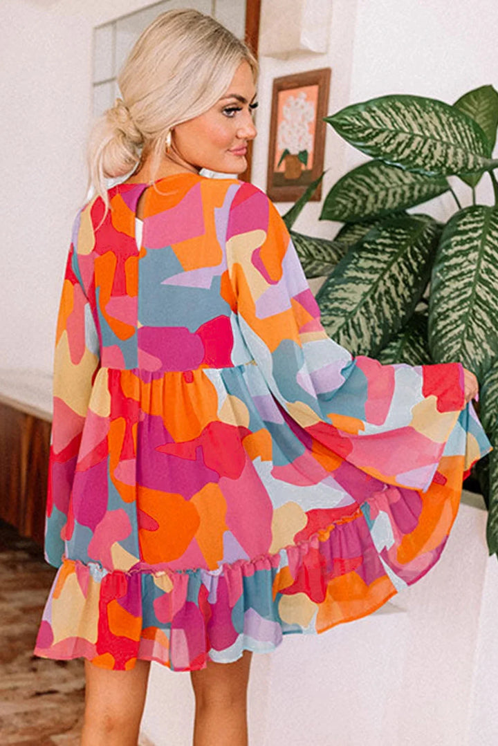 Colorful V-neck babydoll dress with eye-catching prints, ideal for casual occasions.